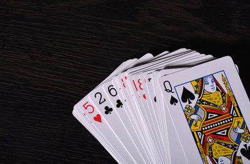 Deck of Playing cards on wooden background