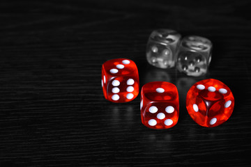 Red and Silver dice on the wooden floor