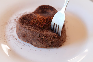 Chocolate lava cake with fork / Chocolate lava cake with heart shape and fork
