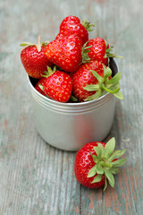 Ripe red strawberries on wooden table