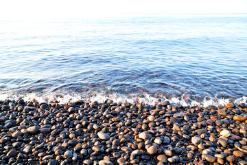stone in the coastline sunrise