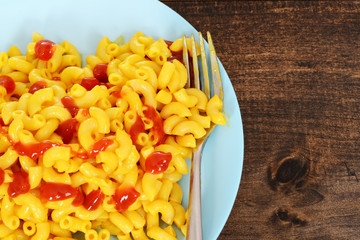 top view macaroni and cheese with fork