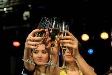 People with champagne in a bar or casino having lots of fun