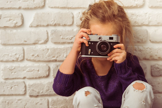Little girl with camera