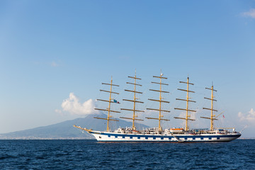 Fototapeta na wymiar Beautiful cruise ship with Mount Vesuvius in the background