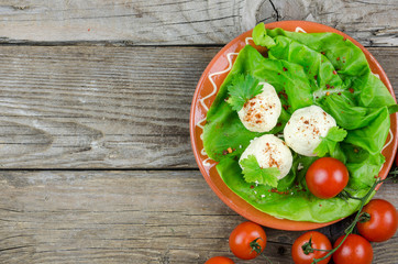 Three balls of cream in a decorated clay pot