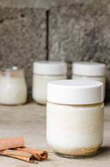 Cinnamon yogurt, rustic background.