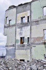 Pieces of Metal and Stone are Crumbling from Demolished Building