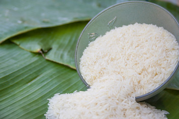 white rice, natural long rice grain for banana leaf background