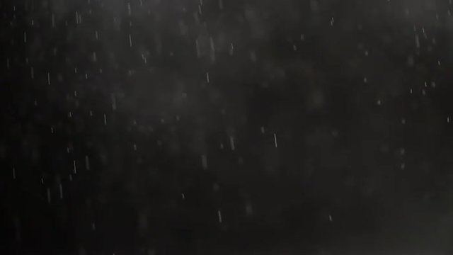 small particles like dust and smoke impact and flow from below over black background slow motion, 180fps prores footage