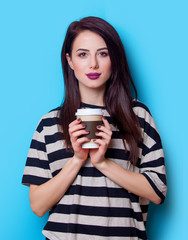 portrait of a young woman with cup of coffee