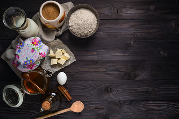 ingredients for baking pancakes on a wooden background