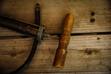 Bicycle Pump on Wood Bench with Two Caps