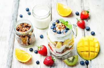 strawberry, mango, kiwi, blueberry, orange with Greek yogurt and