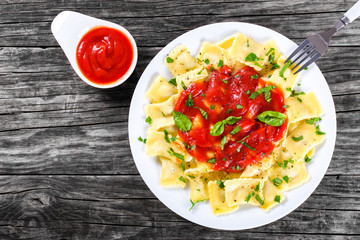 Italian ravioli with tomato sauce, top view