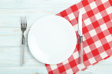 White plate on a blue wooden table