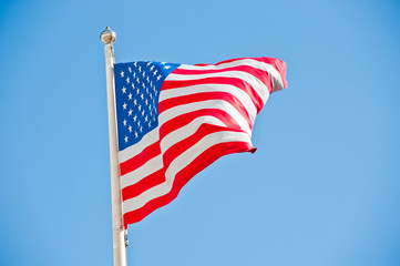 American flag against blue sky
