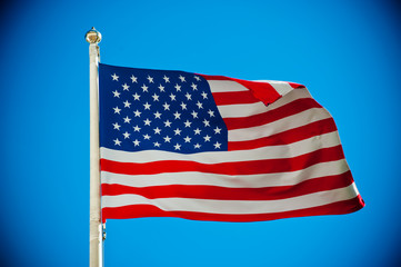 American flag against blue sky