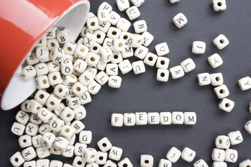 Wood Blocks with the word Feedom. Wooden ABC