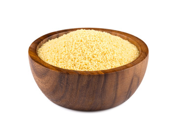 Raw couscous in a wooden bowl