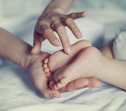baby's feet in the hands
