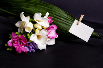 bouquet of freesia and card