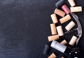 wine corks, corkscrew and bottle of wine