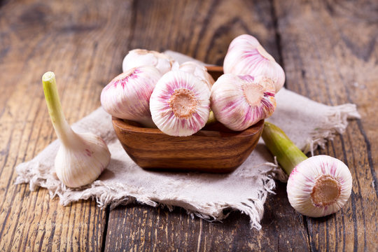 fresh garlic on a wooden table