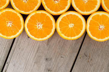 Overhead shot of oranges on an old wooden table