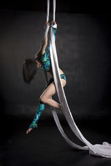 Aerialist doing tricks on silks