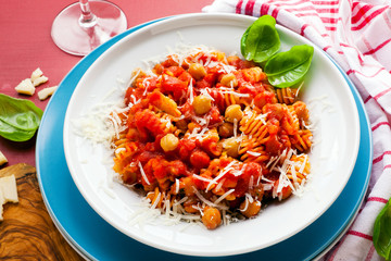  healthy Italian pasta with chickpeas and tomato sauce . parmesa