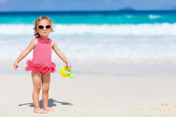 Little girl playing at beach