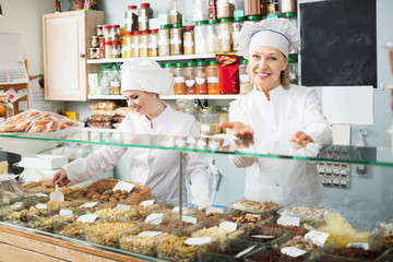 Two female sellers in confectionery