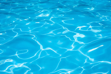 Beautiful Gentle wave in swimming pool with sun reflection