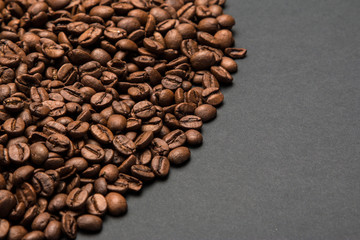Coffee beans on a grey surface