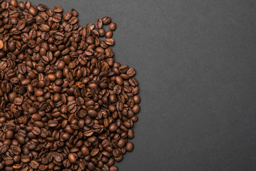 Coffee beans on a grey surface