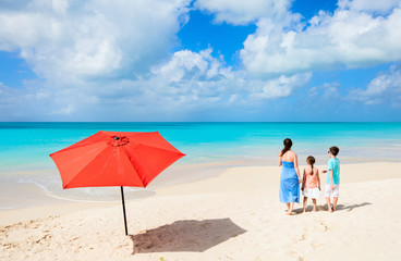 Mother and kids at tropical beach