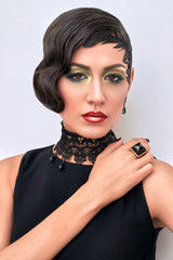 Retro fashion portrait of elegant woman, 1920s styled, feather hairstyle