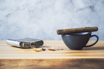 Desktop with cigar and flask © peshkova