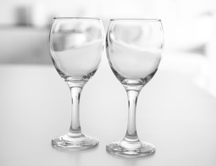 Wineglasses on blurred interior background