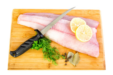 Fresh walleye fillets with knife