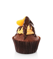 Tasty cupcake with slice of mandarin and chocolate, isolated on white