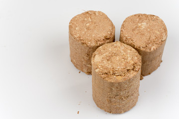 Wooden briquettes over white background