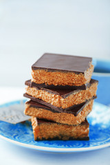 Tasty homemade cakes with chocolate on light background