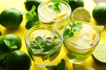 Mojito drinks with lime, lemon and mint, closeup