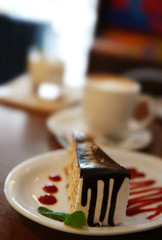 Tasty chocolate cake on table in cafe or restaurant