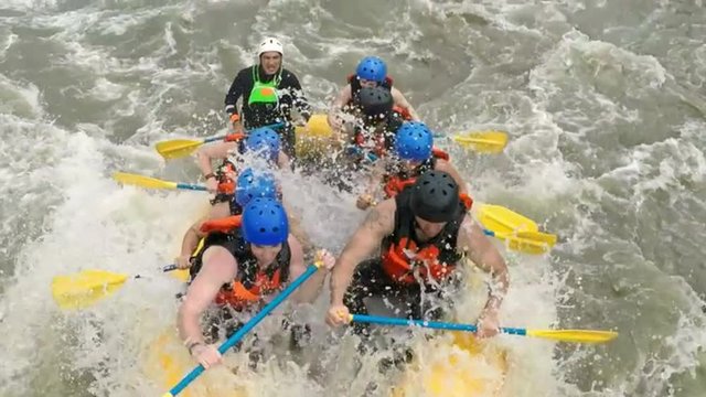 Experience the thrill of navigating class four rapids as you ride the exhilarating waves up and down on an unforgettable whitewater rafting trip.