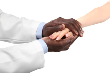 Handshake between doctor and patient isolated on white