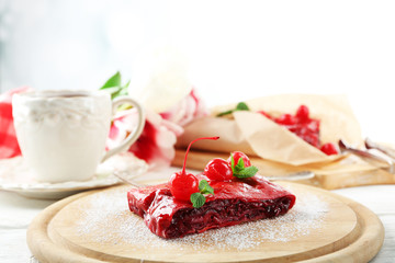 Cherry strudel with mint and cup of tea