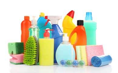 Detergent bottles and cleaning supplies isolated on white
